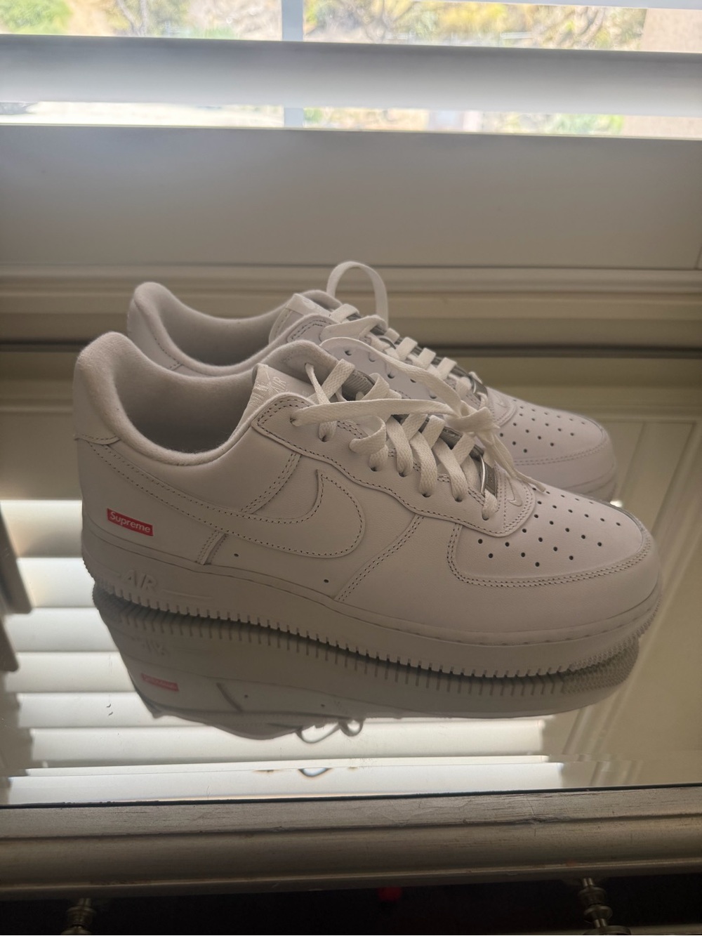 Nike White Low-Top Leather Sneakers with Small Red Logo